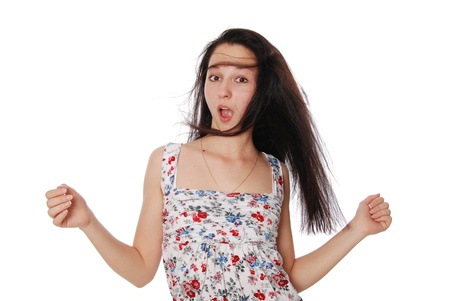 The surprised beautiful girl with an open mouth in color a dressの写真素材