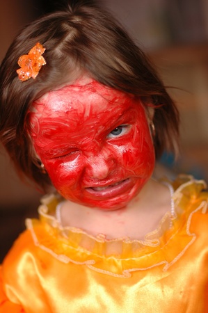 The little girl with cosmetics on the person a aggressionの写真素材