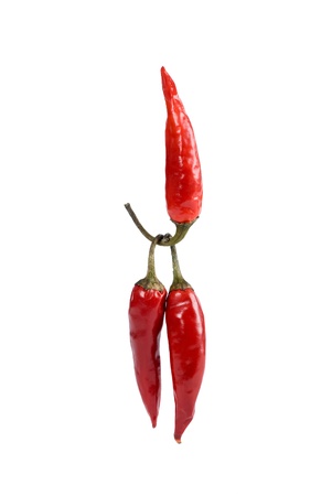 One red hot pepper lifts two pepper,isolated on white backgroundの写真素材