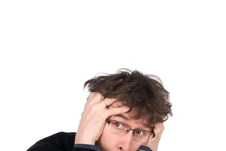 The man wearing spectacles is afraid isolated on white backgroundの写真素材