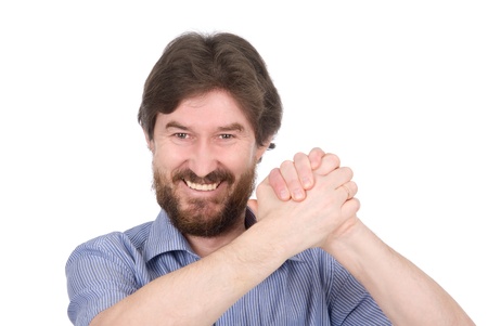 The man with the compressed hands in success position isolated on white backgroundの写真素材