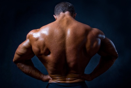 strong athletic man on black backgroundの写真素材
