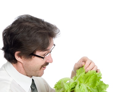 Man rejoices sheet of the salad. Isolated on white backgroundの写真素材