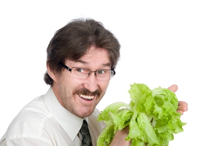 Man rejoices sheet of the salad. Isolated on white backgroundの写真素材