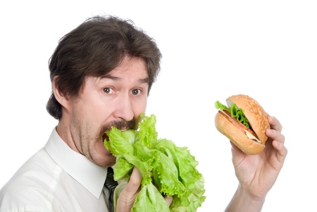 Man prefers salad instead of hamburger. Isolated on white backgroundの写真素材