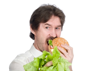 Man prefers hamburger instead of salad. Isolated on white backgroundの写真素材