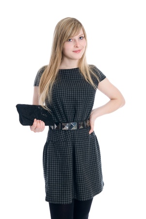 Beautiful businesswoman in dress and clutch smiling and looking to the cameraの写真素材