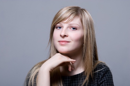 Sensual young blonde woman looking at camera studio shotの写真素材