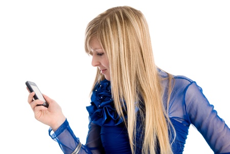 Beautiful blonde in a blue dress with phone isolated on whiteの写真素材