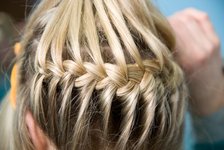 Hairdress a plait in salonの写真素材