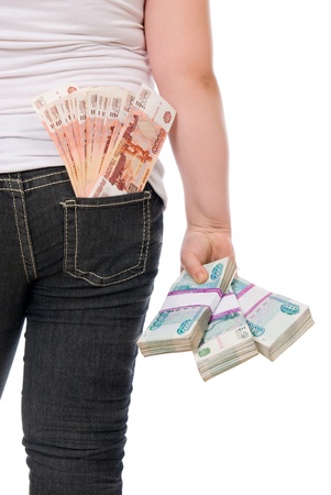 Money sticks out of a hip-pocket and in hands  over white backgroundの写真素材