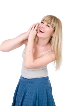 The cheerful blonde with hands on a cheek Isolated over white backgroundの写真素材