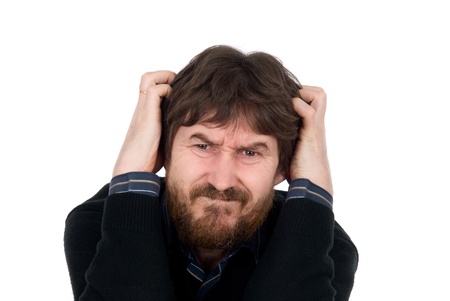 Portrait of upset man with hands on head.Isolated on a white backgroundの写真素材