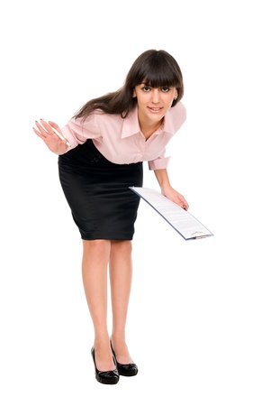 Cheerful secretary with clipboard leaned forward, isolated on white backgroundの写真素材