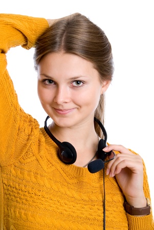Beautiful young woman with headphones with microphone.isolated on whiteの写真素材