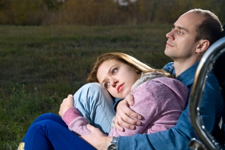 Young couple outdoors at nightの写真素材