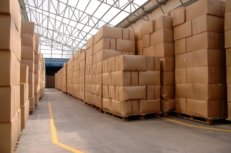 Modern warehouse with cardboard cartons ready to shipの写真素材