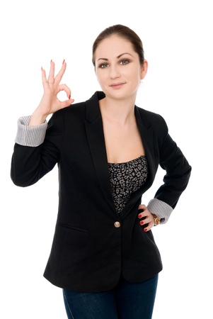 Portrait of attractive businesswoman indicating OK sign isolated on white backgroundの写真素材