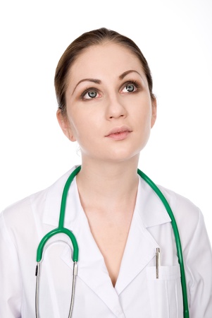 Portrait of a woman doctor looking up. isolated over white backgroundの写真素材