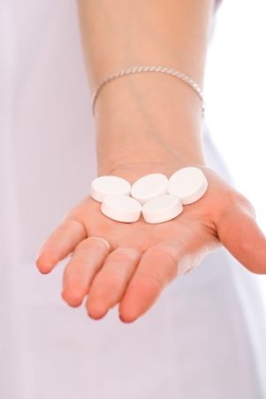 Close-up on the hand big white pill.の写真素材