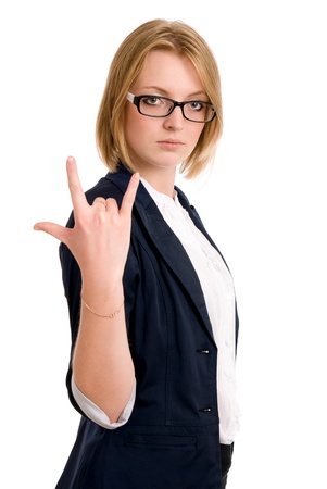 Young woman with characteristic heavy metal hand gesture. isolated on white background.の写真素材
