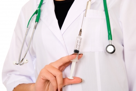 Image of surgeon holding syringe in hand on white backgroundの写真素材
