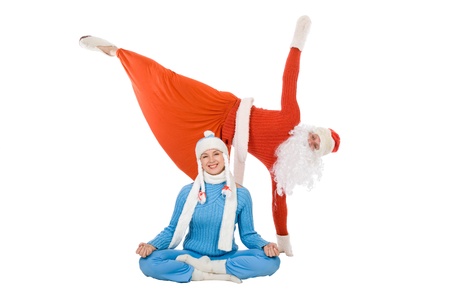 Santa Claus and the Snow Maiden of yoga. Isolated on whiteの写真素材