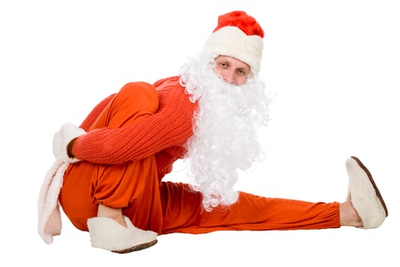 Santa Claus does gymnastics on white backgroundの写真素材