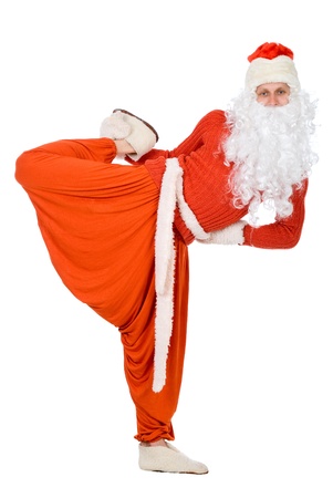 Santa Claus does gymnastics on white backgroundの写真素材