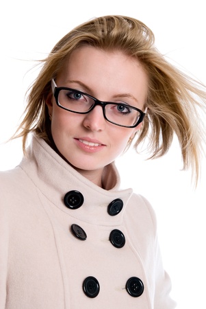 Portrait of charming girl in coat with flowing hair. isolated over white backgroundの写真素材