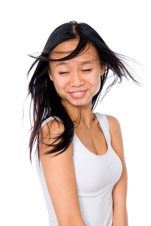 Portrait of young happy brunette with eyes closed, isolated on whiteの写真素材