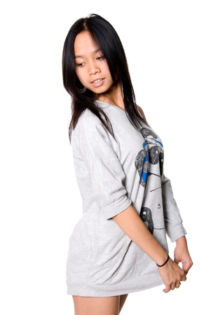 Portrait of Asian girl. Looking down to the side. Isolated on white backgroundの写真素材