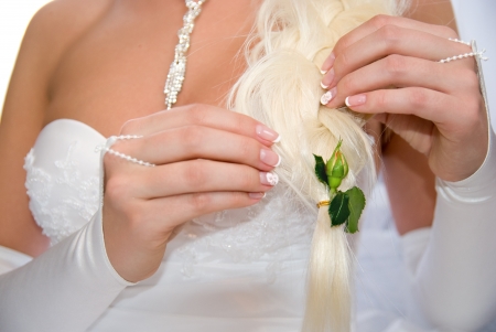 Bride with flower unblown roses in her hair.の写真素材