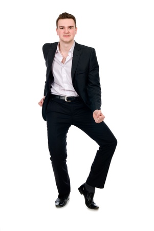 Young businessman in suit dancing. Isolated on white backgroundの写真素材