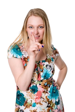 Beautiful girl dissatisfied threatening finger. Isolated on white backgroundの写真素材