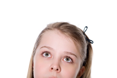 Close-up portrait of a beautiful teenager. Looking up. Lots of copyspace and room for text on this isolate.の写真素材