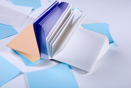 Stack of colorful. Paper records lying on a light background.の写真素材