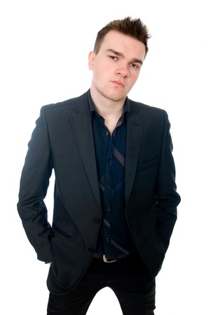 Portrait of a successful young business man. Hands and pockets. Isolated on white backgroundの写真素材