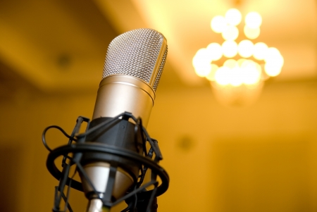Microphone in the conference hall. Background blurred chandelierの写真素材