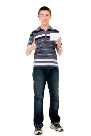 Happy casual young man with a raised finger and a white sheet of paper. Isolated on white backgroundの写真素材