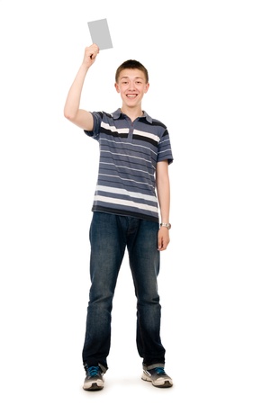 Happy casual young man in his raised hand holds a light clean sheet. Isolated on white backgroundの写真素材
