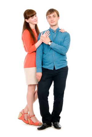 Young love couple in full view. Isolated on white backgroundの写真素材