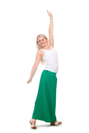 Beautiful female student in a green skirt with hands raised. isolated over whiteの写真素材