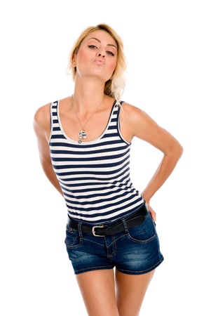 Beautiful young woman sending a kiss to the viewer on white backgroundの写真素材