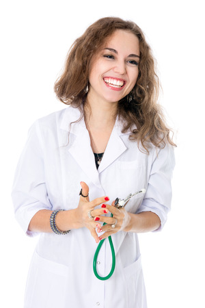 Cheerful girl looking in the direction of a physician. Isolated on white backgroundの写真素材