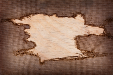 background of burlap with a hole for writing text. texture of the woodの写真素材