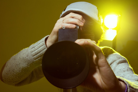 Man with retro camera. cinema operator.の写真素材