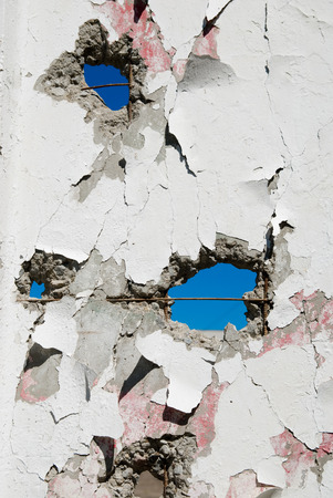 Concrete wall with holes in several places.の写真素材