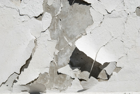 Destruction of plaster on concrete wall.の写真素材
