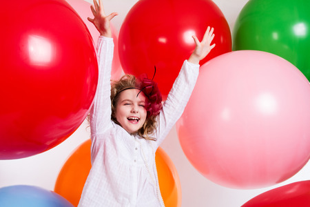 Schastivaya joyful girl on a large balloons. Pradnichny day.の写真素材